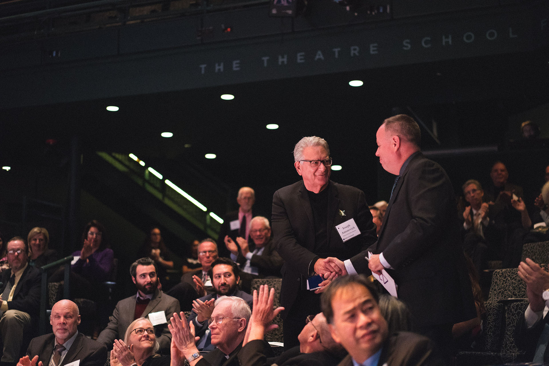 Event co-chairs Joseph Antunovich and Brian Montgomery greet one another before the program begins.